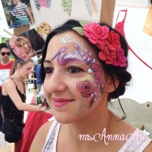 Angel from Mad Love ready to rock her booth with custom face paint by ms Anna